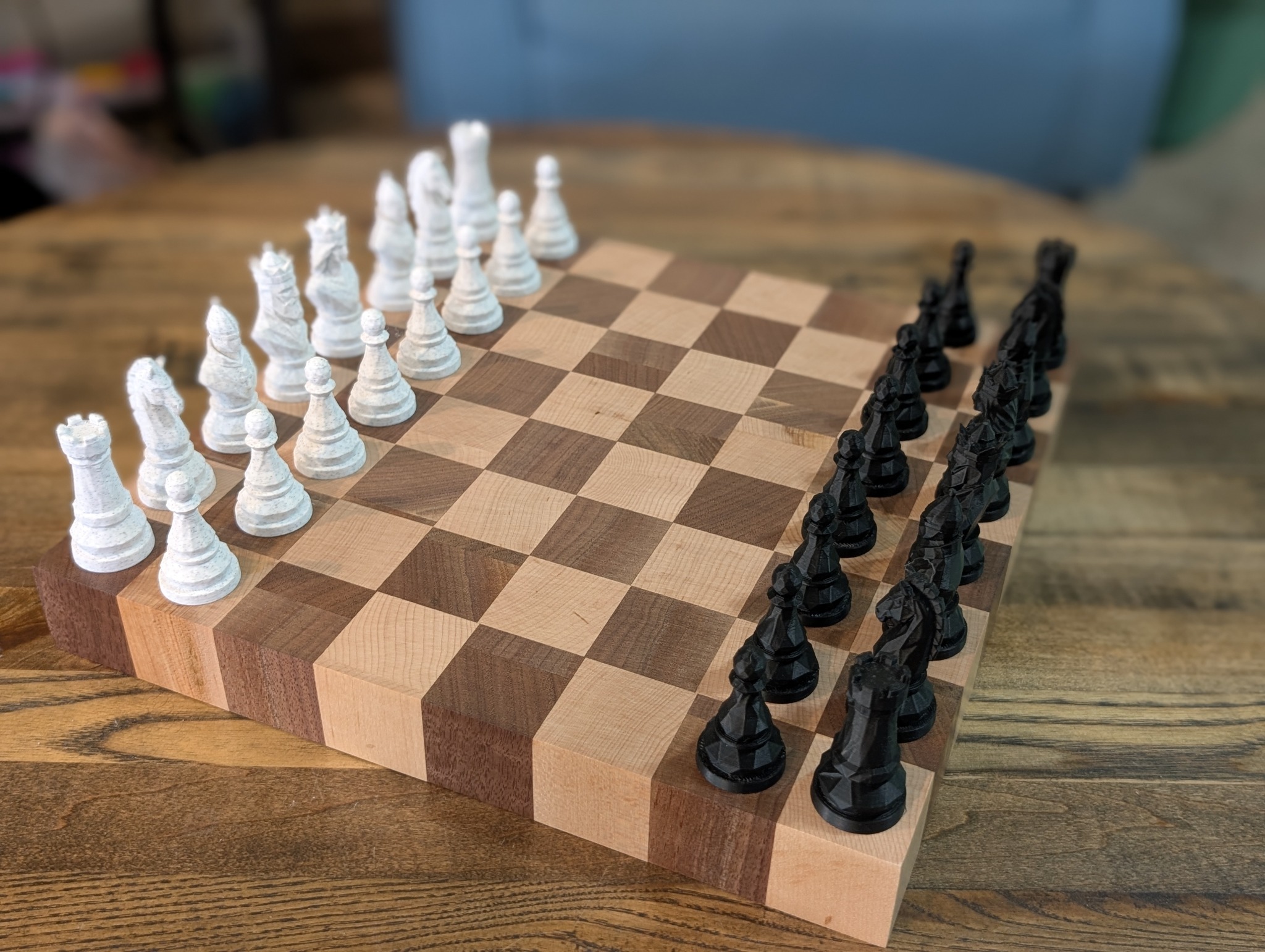 Three handcrafted wooden chess board sets
