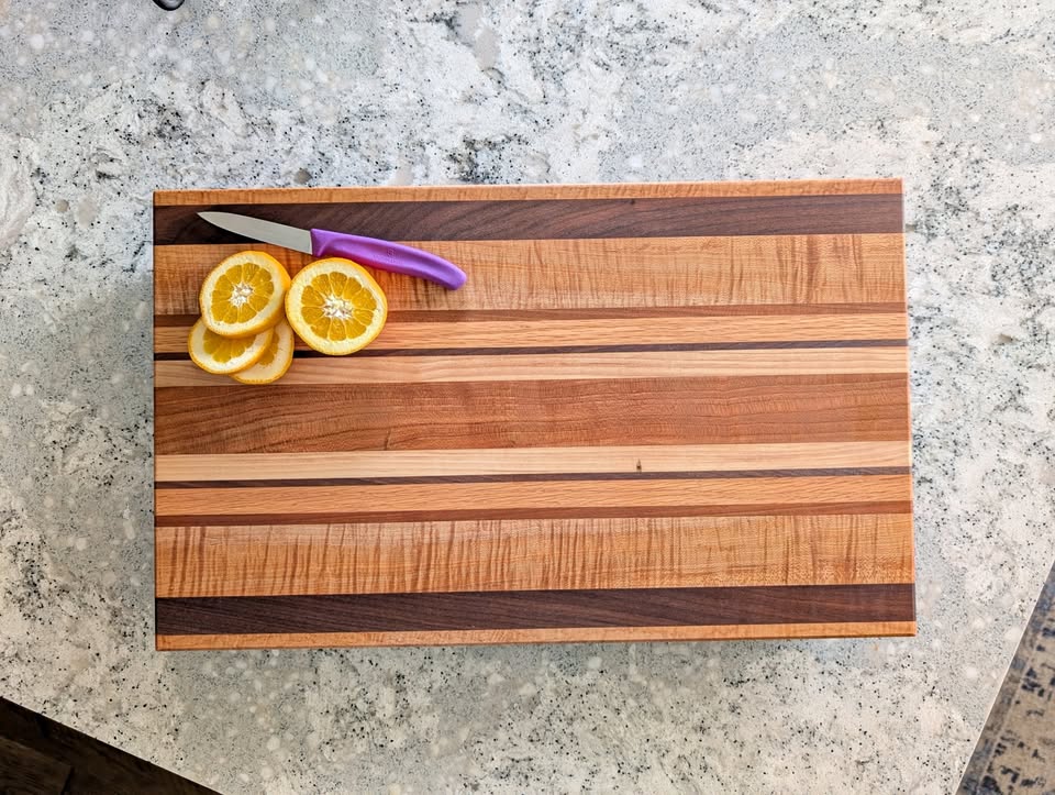 Top view of a custom striped hardwood cutting board